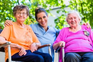 Geriatric nurse having chat with senior women